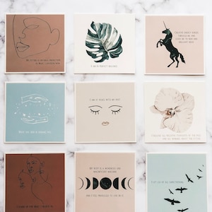 May include: Nine printable affirmation cards with various illustrations and text. The cards feature a unicorn, a monstera leaf, a pair of eyes, a flower, a moon phase, a woman's face, and a flock of birds. The text on the cards includes affirmations such as "I am in perfect balance", "I am at peace with my past", "I release all negative thoughts of the past", "I let go of all expectations", "My body is a wondrous and magnificent machine", "I stand up for what I believe in", "What you seek is seeking you", "My future is an ideal projection of what I envision now", and "Creative energy surges through me and leads me to new and brilliant ideas".