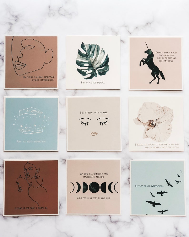 May include: Nine printable affirmation cards with various illustrations and text. The cards feature a unicorn, a monstera leaf, a pair of eyes, a flower, a moon phase, a woman's face, and a flock of birds. The text on the cards includes affirmations such as "I am in perfect balance", "I am at peace with my past", "I release all negative thoughts of the past", "I let go of all expectations", "My body is a wondrous and magnificent machine", "I stand up for what I believe in", "What you seek is seeking you", "My future is an ideal projection of what I envision now", and "Creative energy surges through me and leads me to new and brilliant ideas".
