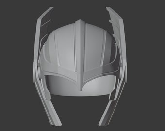 May include: A gray 3D printed helmet with a pointed top and two large wings on the sides.