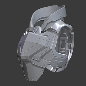 May include: A gray, futuristic-looking piece of armor, possibly a helmet or chest piece, with a complex, geometric design. The object has a metallic sheen and is set against a dark gray background.