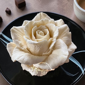 May include: A trio of ceramic mugs with a speckled, matte finish in cream, light grey, and dark grey. Each mug features a minimalist design and a rounded handle.