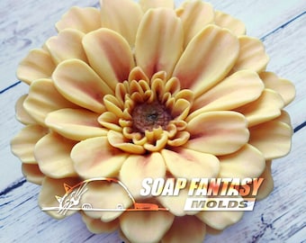 May include: A yellow and orange gerbera daisy flower soap mold. The mold is made of silicone and has a detailed design. The mold is perfect for making realistic-looking soap flowers.