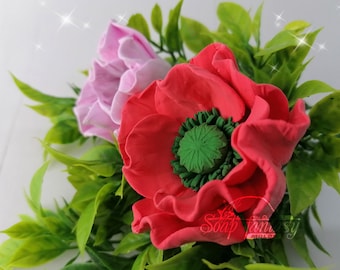 May include: A close-up of a red and pink flower bouquet made of polymer clay. The flowers are surrounded by green leaves. The text "Soap Fantasy Molds" is visible in the bottom right corner of the image.