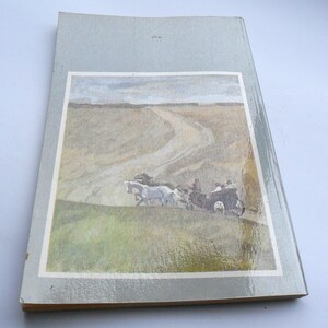 May include: A vintage book cover featuring a painting of a horse-drawn carriage traveling along a dirt road. The road is winding through a field with a cloudy sky in the background.