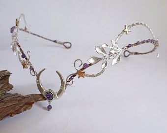 May include: Silver wire headpiece with a crescent moon design, purple amethyst stones, and gold star accents.