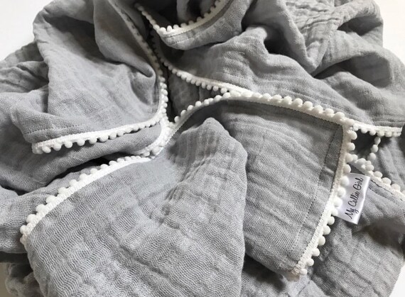 pom pom swaddle blanket