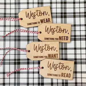 May include: Four wooden gift tags with the name Weston and the words "Something to Wear", "Something You Need", "Something You Want", and "Something to Read".