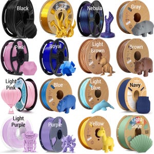 May include: Assortment of 12 spools of filament for 3D printing in various colors, including black, gold, nebula, gray, pink, royal blue, light brown, brown, light pink, blue, light blue, navy, light purple, purple, yellow, and light sage.