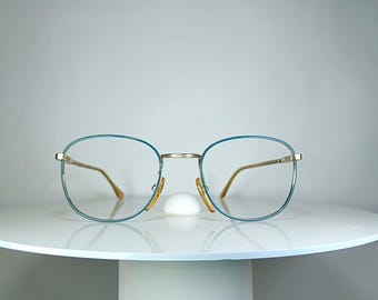 Occhiali da vista BENETTON con montatura placcata oro, nuovi, rimanenze di magazzino.