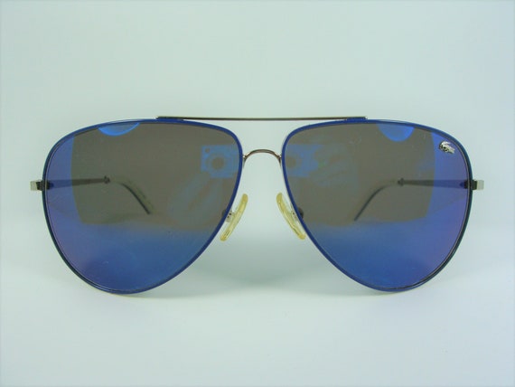 Lacoste 55 mm Blue;White Sunglasses | World of Watches