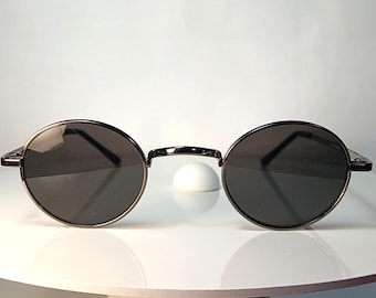 Occhiali da sole Eschenbach in lega di titanio, rotondi o ovali, stile John Lennon, ponte a sella, nuovi, rimanenze di magazzino.