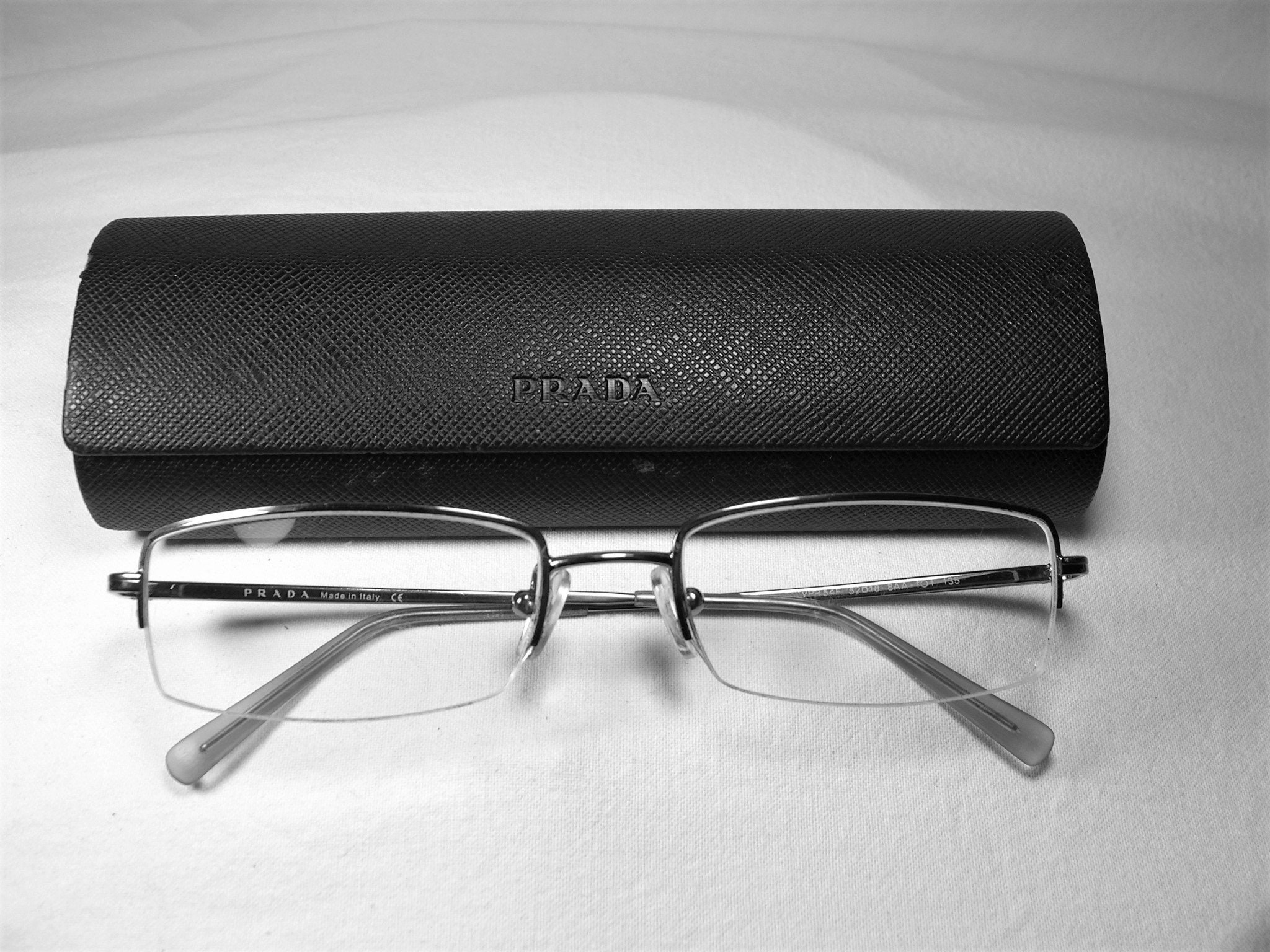 prada titanium glasses