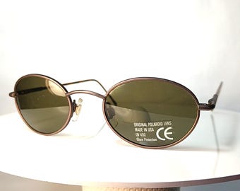 Occhiali da sole POLAROID USA Detective's Special, montatura quadrata/ovale, nuovi, rimanenze di magazzino.