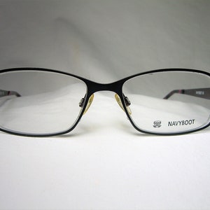 May include: Black rectangular eyeglasses with clear lenses. The brand name "NAVYBOOT" is printed on the right temple.