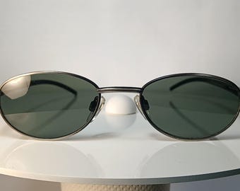 Occhiali da sole ESCHENBACH in lega di titanio, modello Detective's Special, montatura ovale, nuovi, rimanenza di magazzino.