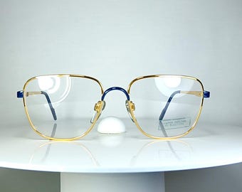 Occhiali da vista BENETTON con montatura placcata oro, nuovi, rimanenze di magazzino.