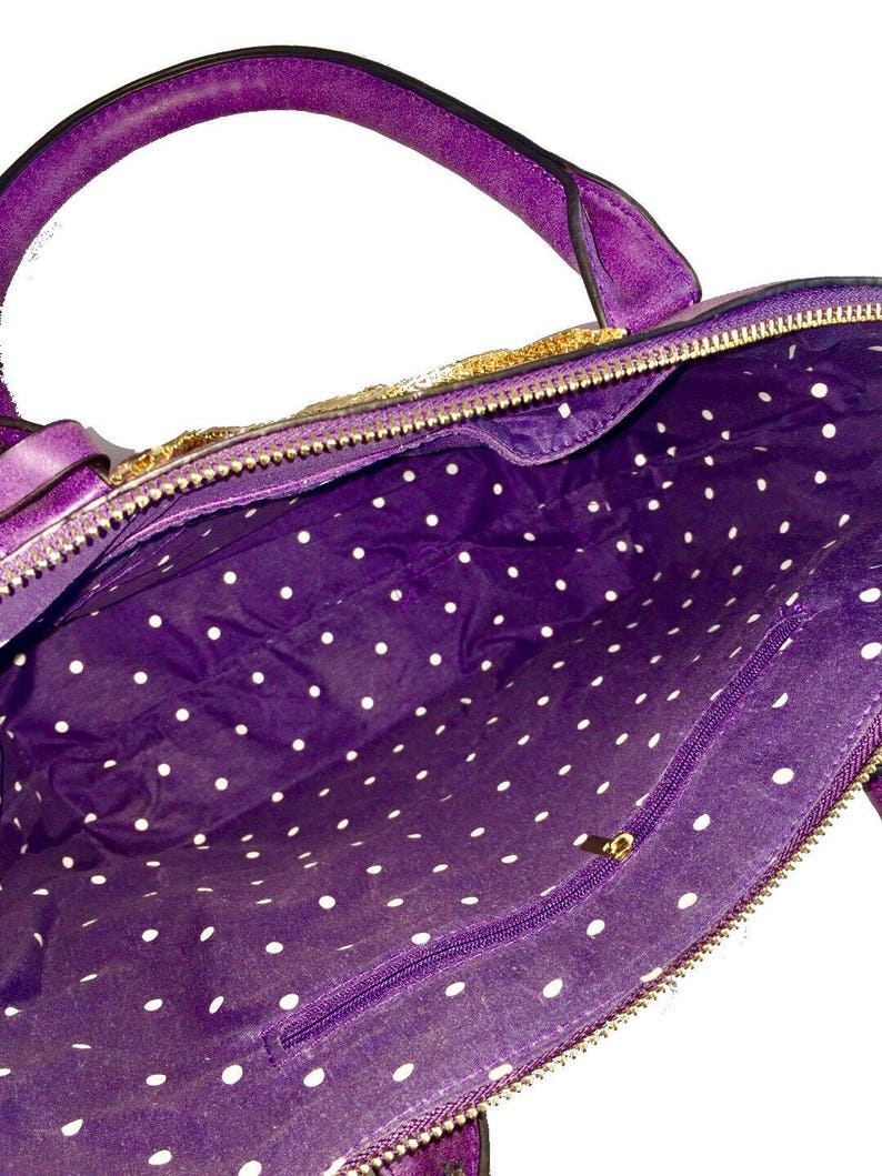 purple faux leather tote bag with gold embellishment