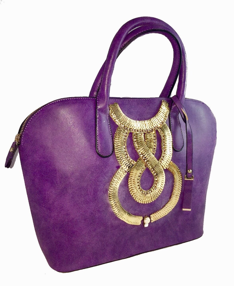 purple faux leather tote bag with gold embellishment