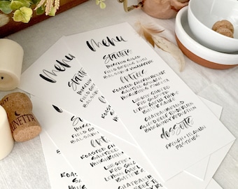 Brush hand lettered white and black dinner party wedding menu