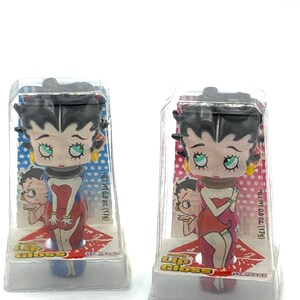 Gorgeous collectible and vintage key chain and  candy lipstick Betty Boop. Only used a key chain.