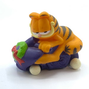 Gorgeous vintage Garfield with a purple car,cat, orange, figurine, toy.