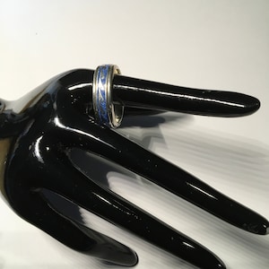 Band ring with blue stone