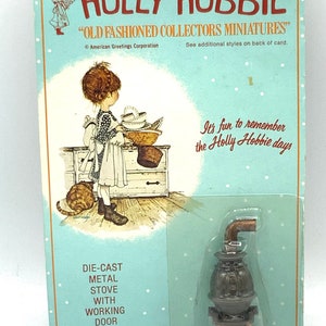 Gorgeous collectible and vintage die-cast metal old fashion stove  with working door by Holly Hobbie. Sealed