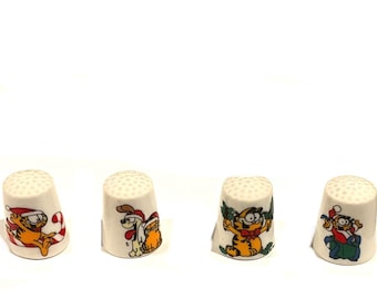Gorgeous collectible and vintage Garfield Santa ceramic Thimble and ornament cat, orange by Enesco.