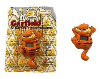 Collectible and Vintage Garfield digital clock, stick-on cat, Nelsonic Cat Cling. Please choose the variation you prefer.