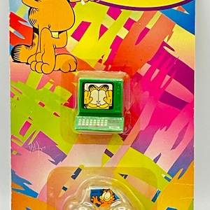 Gorgeous collectible and vintage Garfield sharpeners set of two, computer and car, orange, cat. New seal.