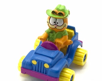 Gorgeous collectible and Vintage Garfield in a car, cat.