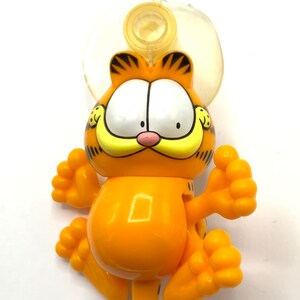 Vintage Garfield with articulated arms when cling on the Window, suction cup, cat, orange, figurine, orange.