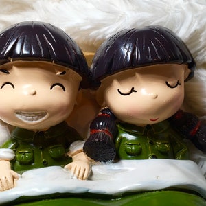 Vintage kids in Bed piggy Bank, Asia