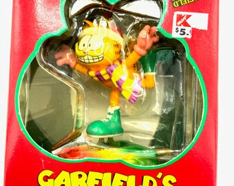 Gorgeous collectible and vintage ornament as Garfield is ice skating , trim-a-tree ornament . With the original box.