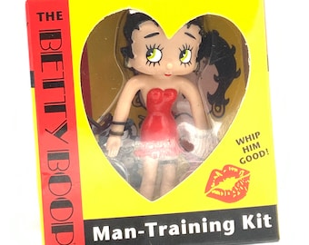 Collectible man-training kit Betty Boop, witH a book.