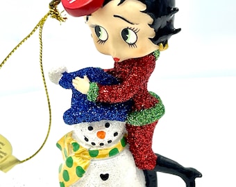 Gorgeous collectible and vintage Betty Boop with a snowman ceramic ornament.