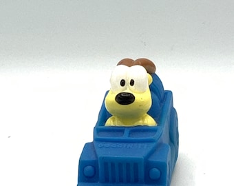 Gorgeous vintage Odie friend of Garfield with a blue car ,cat, orange, figurine, toy, dog.