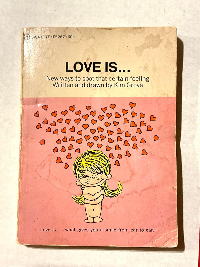 Gorgeous collectible and vintage book of Love is, by Kim Grove, love. Love is