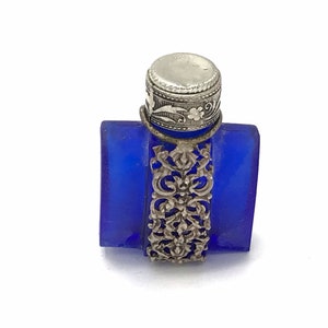 Vintage blue and silver perfume bottle.