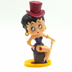 Gorgeous collectible and Vintage Betty Boop is sitting with hat.