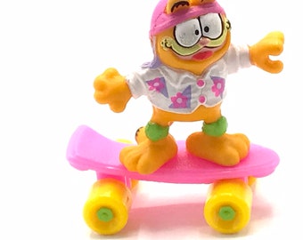 Vintage Garfield on a skateboard, toy.