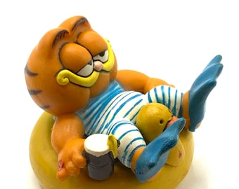 Vintage Garfield  swimming, raft, figurine cat, orange.