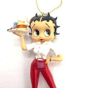 Gorgeous collectible Betty Boop  Christmas ornament as we tres son roller skates.