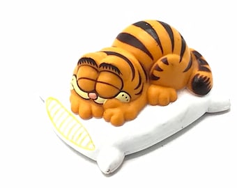 Vintage Garfield is sleeping in a pillow, toy