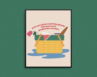 May include: A yellow picnic basket with a red and white checkered plate, a baguette, and a pink flower inside. The text "You can plan a pretty picnic but you can't predict the weather" is written in red and white letters on a beige background.