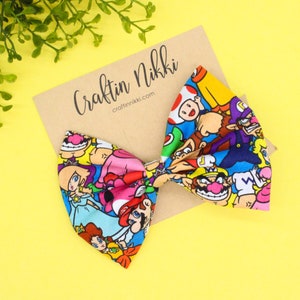 Plumber Racing Friends Tossed Cotton Fabric Hair Bow Clip Set | Adult and Child Size Headbands | Holiday Gifts