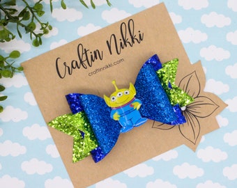 Green Alien in Blue Chunky Blue Eyes Fine Glitter Hair Bow Clip | Straw Topper & Badge Reel and Pet Bowtie | Story Toys