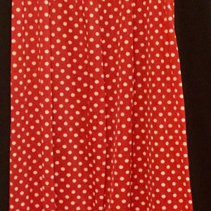 May include: Red wide-leg pants with a white polka dot pattern.
