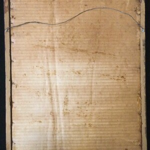 May include: The back of a framed picture with a brown cardboard backing and a wire hanger.