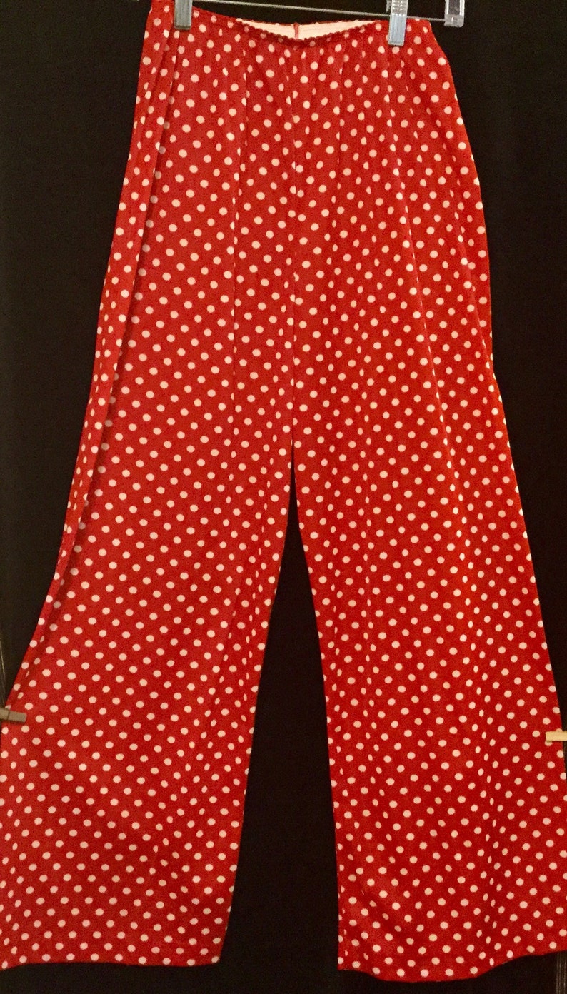 May include: Red wide-leg pants with white polka dots.